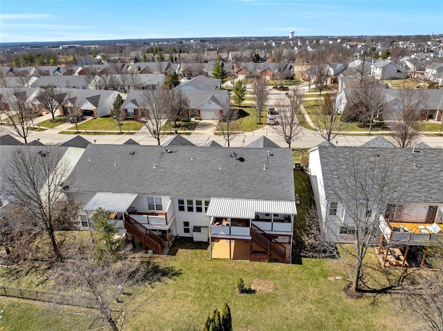 birds eye view of property with a residential view