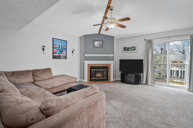 living room with light carpet, a textured ceiling, lofted ceiling, and a fireplace