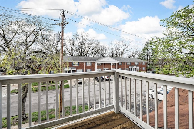 wooden terrace with a residential view