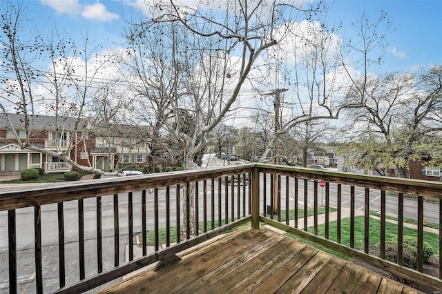 wooden terrace with a residential view