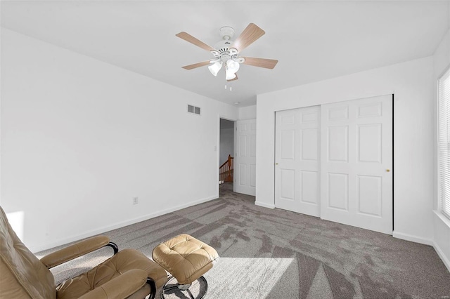 unfurnished bedroom with visible vents, a closet, carpet, baseboards, and ceiling fan