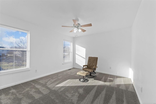 unfurnished room featuring baseboards, carpet, and ceiling fan