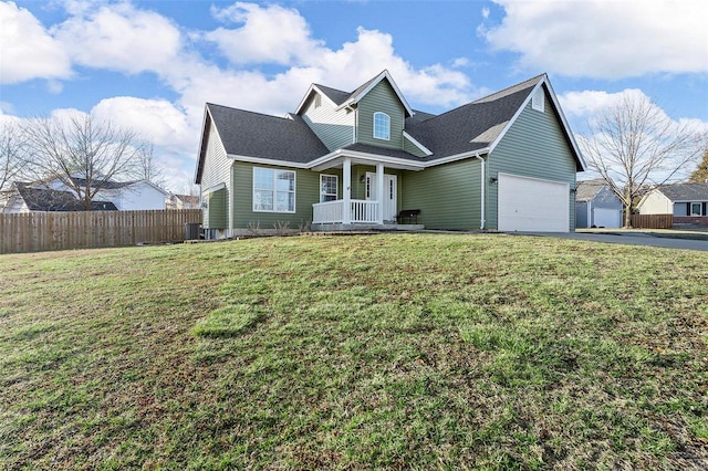 view of front of house featuring a front yard, central AC unit, fence, driveway, and a garage