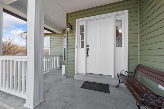 property entrance with covered porch