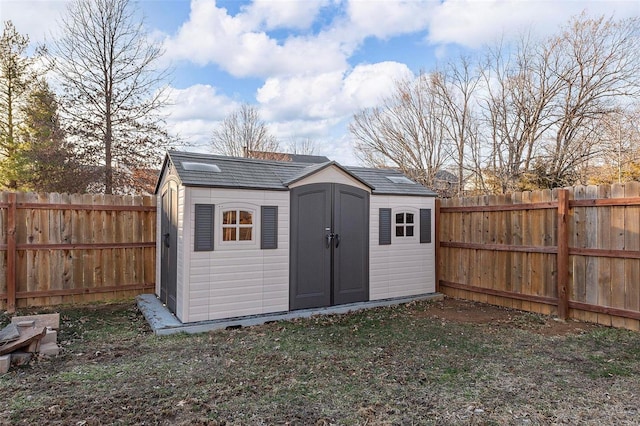 view of shed featuring a fenced backyard