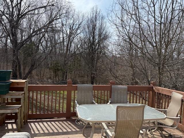 wooden terrace featuring outdoor dining area