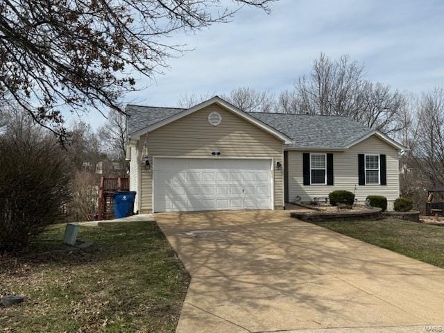 ranch-style house with concrete driveway and an attached garage