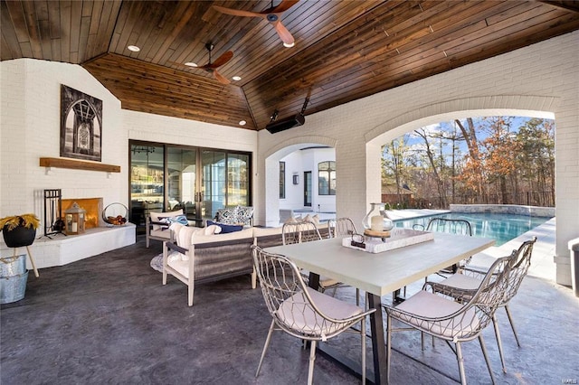 view of patio with an outdoor living space, a fenced in pool, outdoor dining area, and ceiling fan