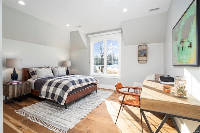 bedroom featuring recessed lighting, visible vents, and wood finished floors