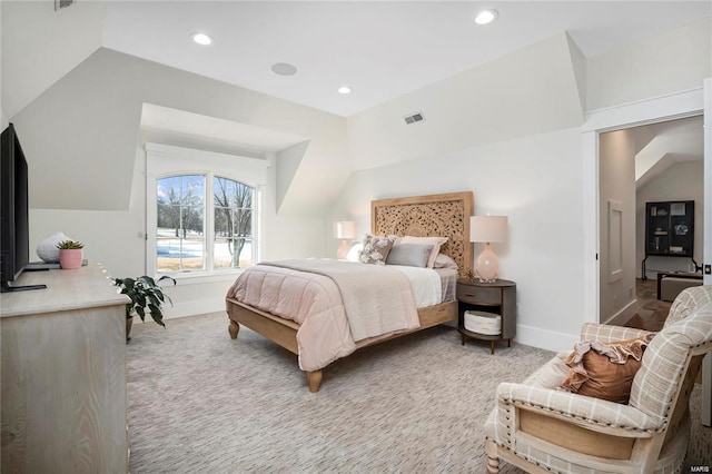 bedroom featuring vaulted ceiling, recessed lighting, light colored carpet, and visible vents