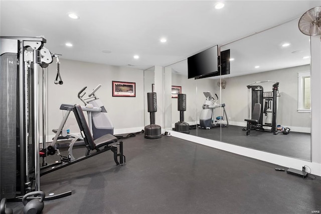 exercise area with recessed lighting and baseboards