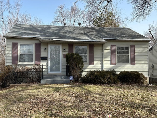 view of front of house with roof with shingles