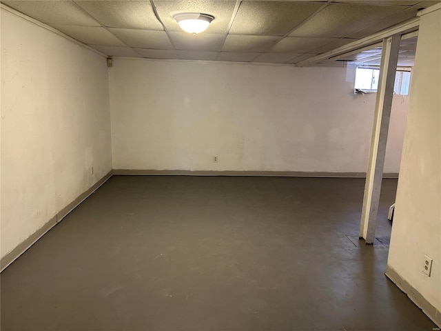 basement featuring a paneled ceiling