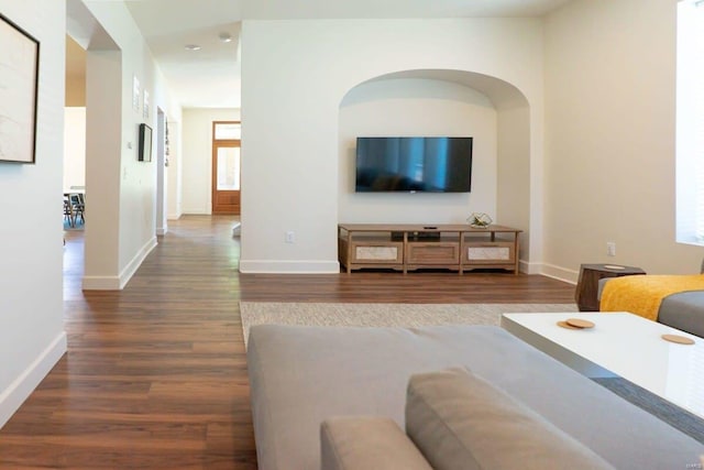 living room featuring wood finished floors and baseboards