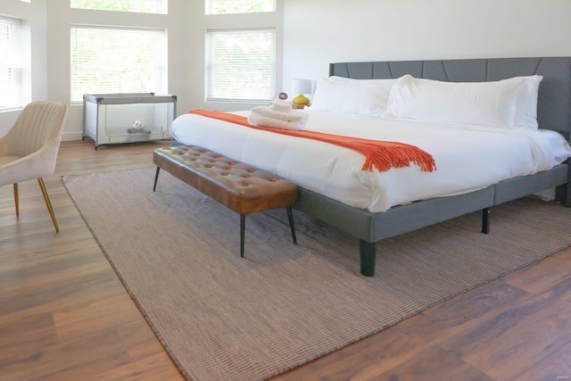 bedroom featuring wood finished floors