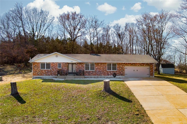 ranch-style home featuring brick siding, an attached garage, concrete driveway, and a front lawn