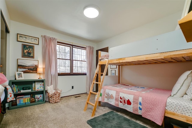 bedroom featuring carpet flooring and visible vents