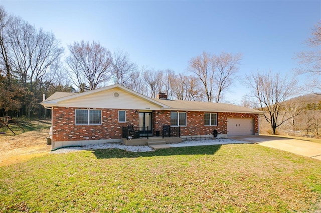 single story home featuring brick siding, a chimney, concrete driveway, and a front lawn