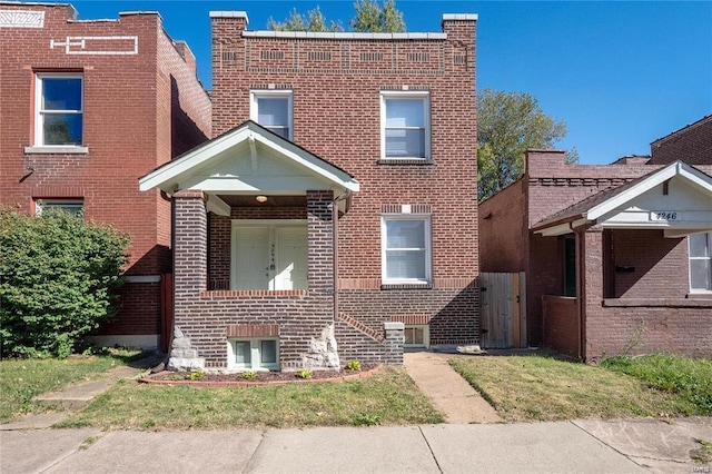 view of front of home with brick siding