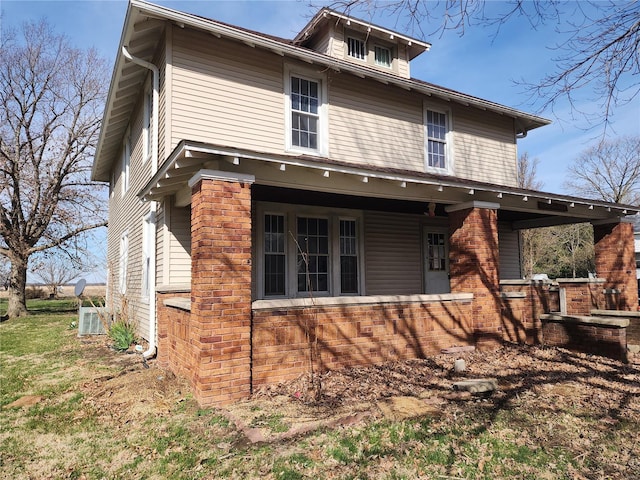 back of house with covered porch