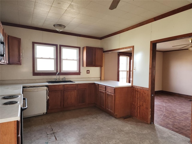 kitchen with dishwasher, a ceiling fan, a sink, brown cabinetry, and electric range