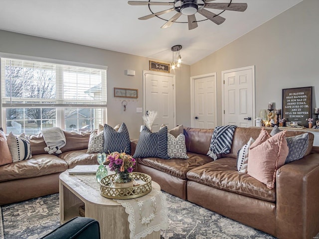 living area featuring vaulted ceiling and ceiling fan