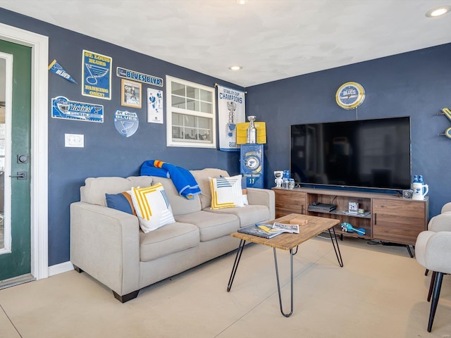 living area with recessed lighting and baseboards