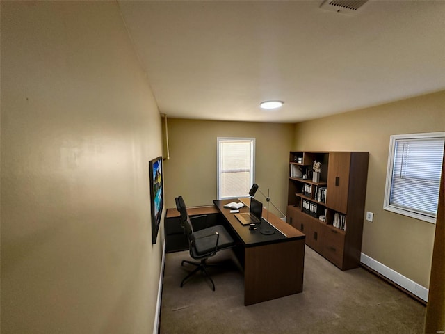 carpeted home office with baseboards and visible vents