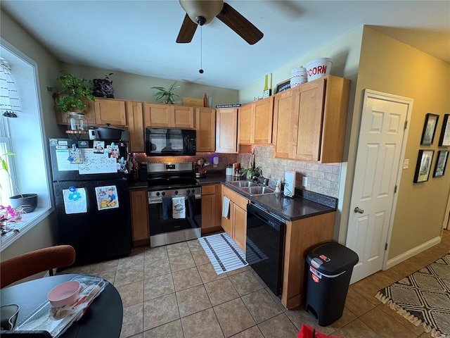 kitchen with a healthy amount of sunlight, a sink, decorative backsplash, black appliances, and dark countertops