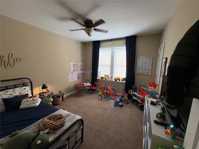 carpeted bedroom with baseboards and ceiling fan