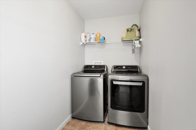 laundry room with washer and dryer, laundry area, and baseboards