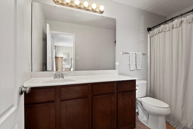 full bathroom with vanity, toilet, and a shower with curtain