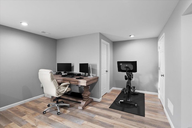 home office featuring recessed lighting, visible vents, baseboards, and wood finished floors