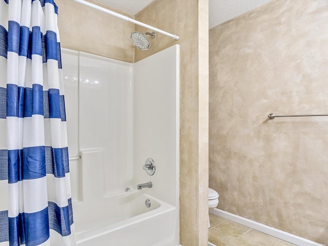 full bathroom featuring tile patterned flooring, shower / bath combination with curtain, a textured ceiling, and toilet