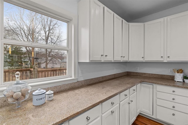 kitchen featuring white cabinets