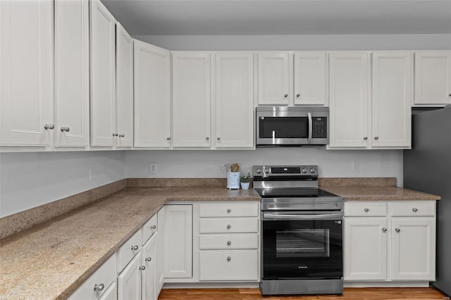 kitchen with white cabinets and stainless steel appliances