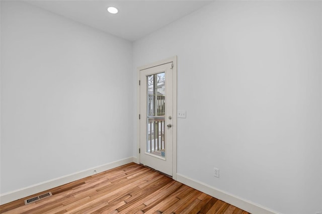 spare room with visible vents, recessed lighting, baseboards, and light wood-style floors