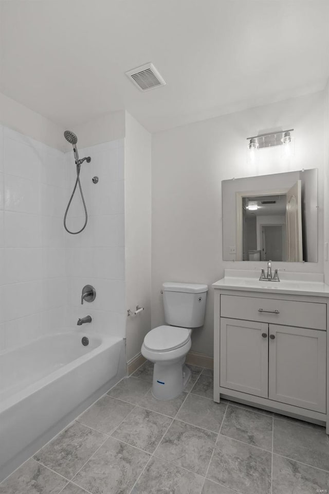 full bathroom featuring vanity, baseboards, visible vents, shower / washtub combination, and toilet