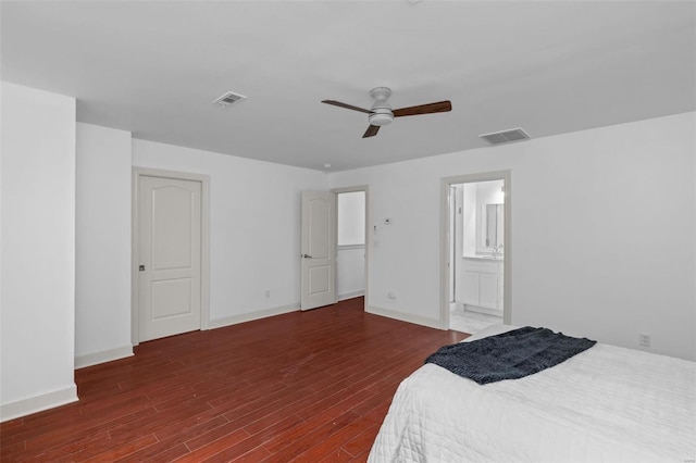 bedroom with visible vents, a ceiling fan, baseboards, and wood finished floors