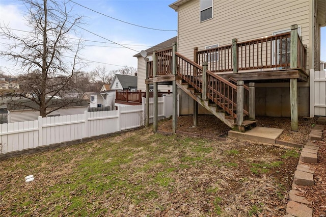 view of yard featuring stairway, a wooden deck, and fence