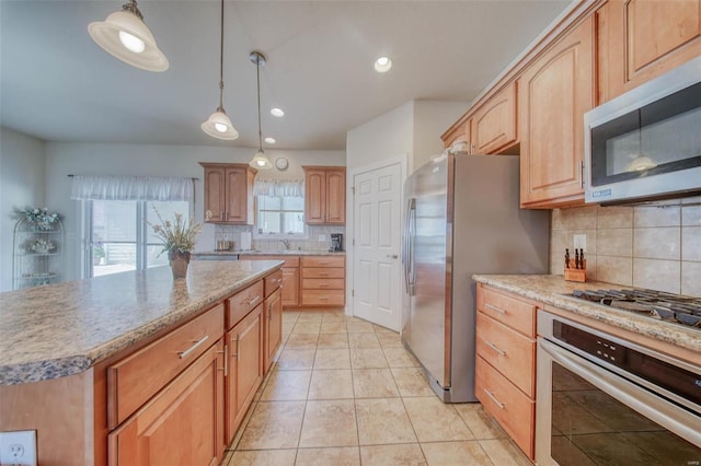 kitchen featuring decorative light fixtures, recessed lighting, appliances with stainless steel finishes, light tile patterned floors, and decorative backsplash