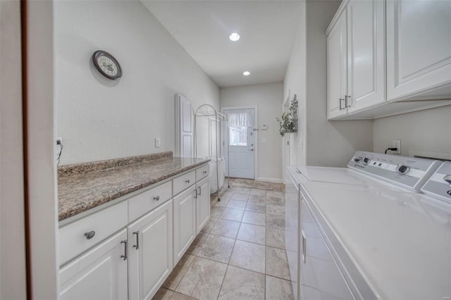 laundry area featuring cabinet space, recessed lighting, independent washer and dryer, and baseboards