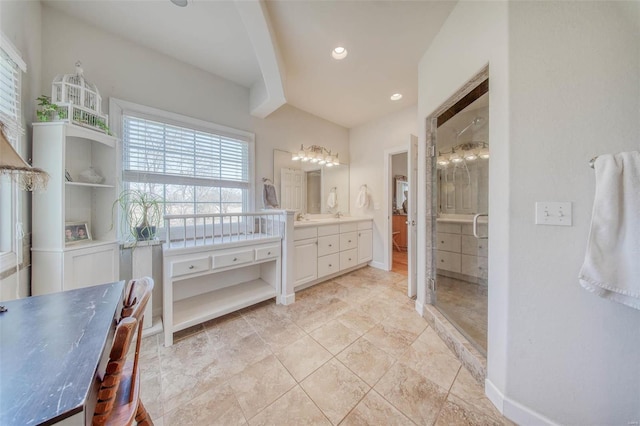 full bath featuring vanity, recessed lighting, baseboards, and walk in shower