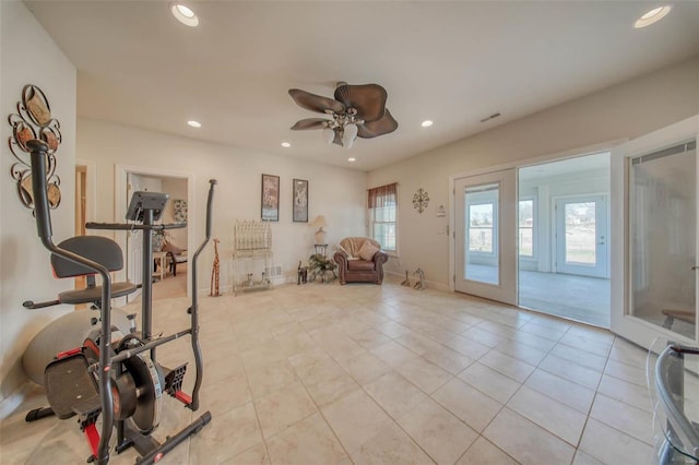 exercise area featuring visible vents, baseboards, ceiling fan, light tile patterned floors, and recessed lighting