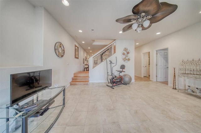 interior space with recessed lighting, baseboards, a ceiling fan, and stairs