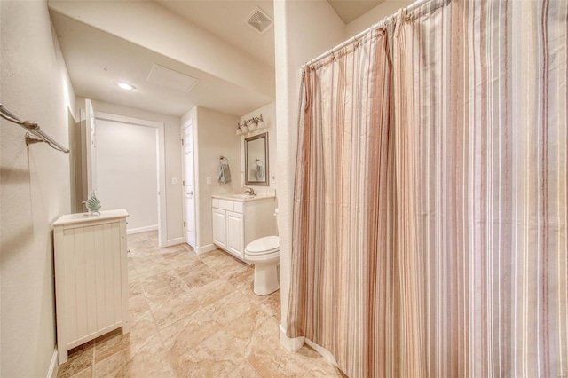 bathroom featuring visible vents, baseboards, toilet, and vanity