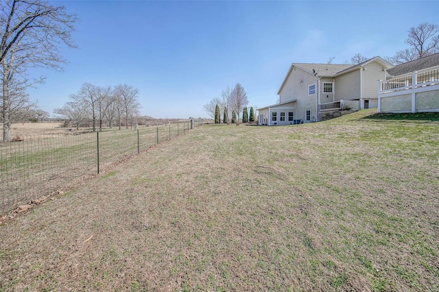 view of yard featuring a rural view and fence