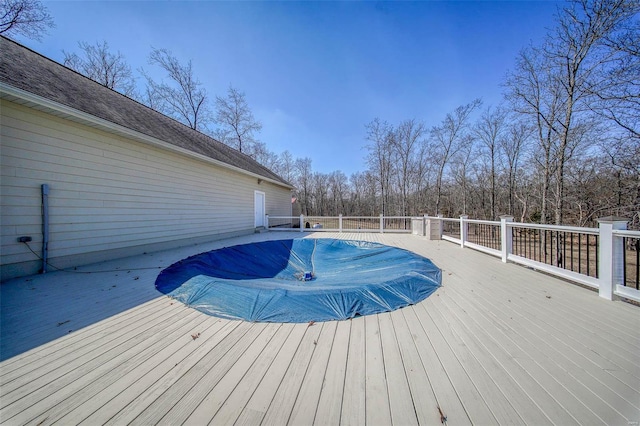 view of pool featuring a wooden deck