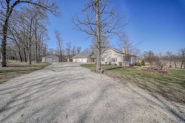 exterior space featuring gravel driveway