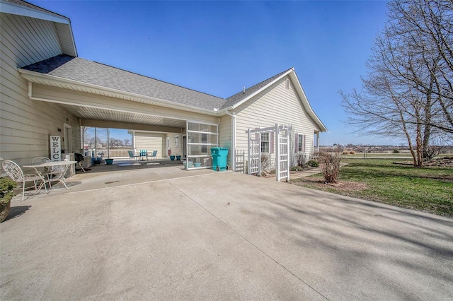 exterior space with a carport